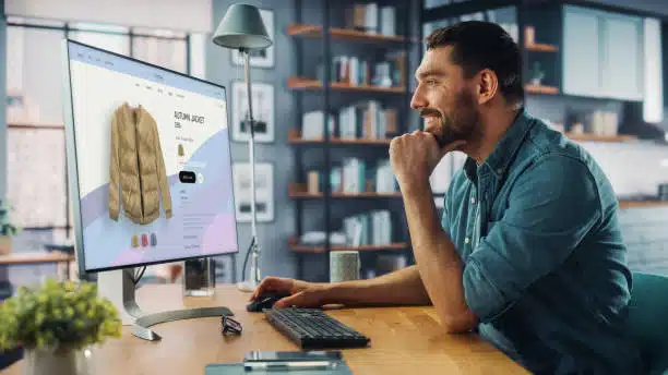 man is looking at a jacket on an online store.